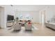 Bright living room features neutral decor, tile flooring, and abundant natural light at 15212 Sw 27Th Ct, Ocala, FL 34473