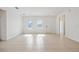 Bright living room featuring tile floors, neutral walls, and natural light streaming through the windows at 15212 Sw 27Th Ct, Ocala, FL 34473