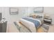 A bright and calming main bedroom features artwork, neutral tones, and ample light at 15212 Sw 27Th Ct, Ocala, FL 34473