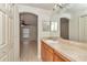 Bathroom vanity with ample countertop space, complemented by neutral tones and tile flooring at 15711 Sw 52Nd Avenue Rd, Ocala, FL 34473