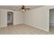 A bright bedroom with neutral walls and tile floors offers a serene space at 15711 Sw 52Nd Avenue Rd, Ocala, FL 34473