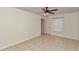 Bright bedroom with tile flooring and a ceiling fan offers comfort and style at 15711 Sw 52Nd Avenue Rd, Ocala, FL 34473