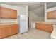 Inviting kitchen featuring wood cabinets, efficient appliances, and ample counter space at 15711 Sw 52Nd Avenue Rd, Ocala, FL 34473