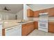 A kitchen featuring a stainless steel sink and white appliances at 15711 Sw 52Nd Avenue Rd, Ocala, FL 34473