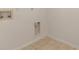 Bright laundry room featuring tile flooring and essential hookups, efficient for chores at 15711 Sw 52Nd Avenue Rd, Ocala, FL 34473