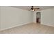 Living room featuring tile floors, neutral paint, and views of the adjacent kitchen area at 15711 Sw 52Nd Avenue Rd, Ocala, FL 34473