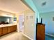 Bright bathroom featuring a double vanity, walk-in shower, and neutral-colored walls and carpet at 15822 Sw 16Th Avenue Rd, Ocala, FL 34473
