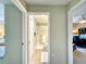 View through hallway door to bathroom with shower and to bedroom and office at 15822 Sw 16Th Avenue Rd, Ocala, FL 34473