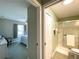 Bathroom with shower seen through doorway from bedroom at 15822 Sw 16Th Avenue Rd, Ocala, FL 34473