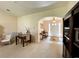 Inviting foyer with tile floors, a charming rug, a bench, and an archway leading to the living area at 15822 Sw 16Th Avenue Rd, Ocala, FL 34473