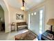 Bright foyer featuring natural light, neutral walls, bench seating, decorative rug, and tile flooring at 15822 Sw 16Th Avenue Rd, Ocala, FL 34473