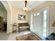 Welcoming foyer featuring natural light, neutral walls, tile flooring, bench seating, and a colorful rug at 15822 Sw 16Th Avenue Rd, Ocala, FL 34473
