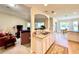 Spacious kitchen with stainless steel sink overlooking the living room and dining area at 15822 Sw 16Th Avenue Rd, Ocala, FL 34473