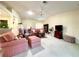 Spacious living room with vaulted ceilings, comfortable furniture, and an open layout at 15822 Sw 16Th Avenue Rd, Ocala, FL 34473