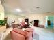 Bright and airy living room featuring a ceiling fan, comfortable seating, and an open floor plan at 15822 Sw 16Th Avenue Rd, Ocala, FL 34473