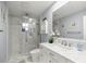 Modern bathroom featuring a glass shower, vanity with marble countertop, and decorative accents at 2201 Ne 45Th St, Ocala, FL 34479