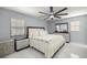 Beautiful bedroom with floral bedding, modern furniture, and a ceiling fan at 2201 Ne 45Th St, Ocala, FL 34479