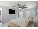 Stylish bedroom with a ceiling fan, TV, and closet space at 2201 Ne 45Th St, Ocala, FL 34479