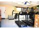 View of the garage with refrigerator, cabinets, sink and epoxy flooring at 2201 Ne 45Th St, Ocala, FL 34479