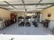 Spacious garage with epoxy flooring, showcasing fitness equipment, laundry, and organized storage solutions at 2201 Ne 45Th St, Ocala, FL 34479