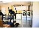The garage includes an exercise area and a laundry room in the background at 2201 Ne 45Th St, Ocala, FL 34479
