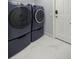 Laundry area featuring modern washer and dryer units with ample space at 2201 Ne 45Th St, Ocala, FL 34479
