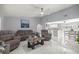 Bright living room featuring white marble floors, neutral paint, and an open floor plan at 2201 Ne 45Th St, Ocala, FL 34479