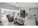Bright, open-concept living area with neutral paint, white marble floors, and a modern ceiling fan at 2201 Ne 45Th St, Ocala, FL 34479