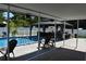 Covered patio featuring views of the in-ground pool and gazebo area, perfect for enjoying the outdoors at 2201 Ne 45Th St, Ocala, FL 34479