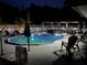 A swimming pool provides a relaxing nighttime experience enhanced by underwater lighting and a gazebo at 2201 Ne 45Th St, Ocala, FL 34479