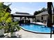 A beautiful pool is complimented by a stylish gazebo and well-manicured landscaping at 2201 Ne 45Th St, Ocala, FL 34479