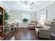 Relaxing den with hardwood floors, reading chairs, and bright windows at 2478 Nw 53Rd Avenue Rd, Ocala, FL 34482