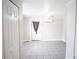Inviting room with tile floors, a ceiling fan, an external door, and a mini-split air conditioner at 2563 Coral Ave, Kissimmee, FL 34741