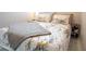 Bedroom featuring patterned bedding, a gray throw blanket, and a bedside table at 2563 Coral Ave, Kissimmee, FL 34741