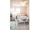 Bedroom featuring white tile floor, white dresser, and a bed with patterned bedding at 2563 Coral Ave, Kissimmee, FL 34741