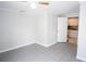 Welcoming bedroom with tile floors and a peek into the adjacent kitchen area at 2563 Coral Ave, Kissimmee, FL 34741