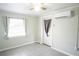 Inviting room with tile floors, a ceiling fan, an AC unit, and natural light at 2563 Coral Ave, Kissimmee, FL 34741