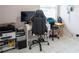Functional home office with tiled floors and ample desk space near window at 2563 Coral Ave, Kissimmee, FL 34741