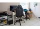 Functional home office with tiled floors and ample desk space near window at 2563 Coral Ave, Kissimmee, FL 34741
