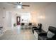 Spacious open-plan living room flows into the kitchen, featuring sleek tile floors at 2563 Coral Ave, Kissimmee, FL 34741