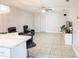 Spacious living room with tile floors, modern lighting, and comfortable seating at 2563 Coral Ave, Kissimmee, FL 34741