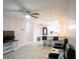 Spacious open-plan living room flows into the kitchen, featuring sleek tile floors at 2563 Coral Ave, Kissimmee, FL 34741