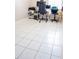 A room featuring neutral walls, tiled flooring and furnished with an office setup at 2563 Coral Ave, Kissimmee, FL 34741