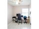 Neutral room featuring neutral walls, tiled flooring and furnished with an office setup at 2563 Coral Ave, Kissimmee, FL 34741