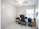 Neutral room featuring neutral walls, tiled flooring and furnished with an office setup at 2563 Coral Ave, Kissimmee, FL 34741