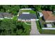 This aerial shot showcases the charming single-story home with a well-kept lawn and backyard at 26 Hemlock Terrace Dr, Ocala, FL 34472