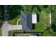This aerial shot offers a bird's-eye view of the home with its large backyard and detached garage at 26 Hemlock Terrace Dr, Ocala, FL 34472