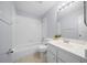 Bathroom featuring a bathtub with shower, toilet, vanity, and a mirror at 26 Hemlock Terrace Dr, Ocala, FL 34472