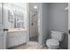 Well-lit bathroom featuring a walk-in shower and ample vanity space at 26 Hemlock Terrace Dr, Ocala, FL 34472