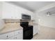 The kitchen showcases stainless steel appliances and white cabinetry at 26 Hemlock Terrace Dr, Ocala, FL 34472